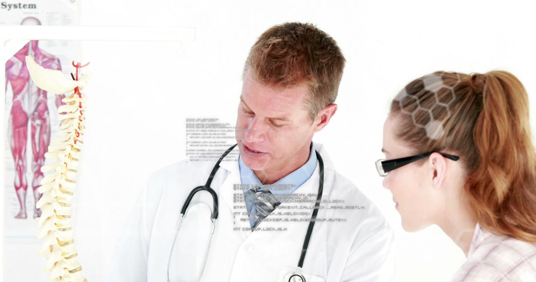 Scientists Analyzing Spine Model in High-Tech Environment