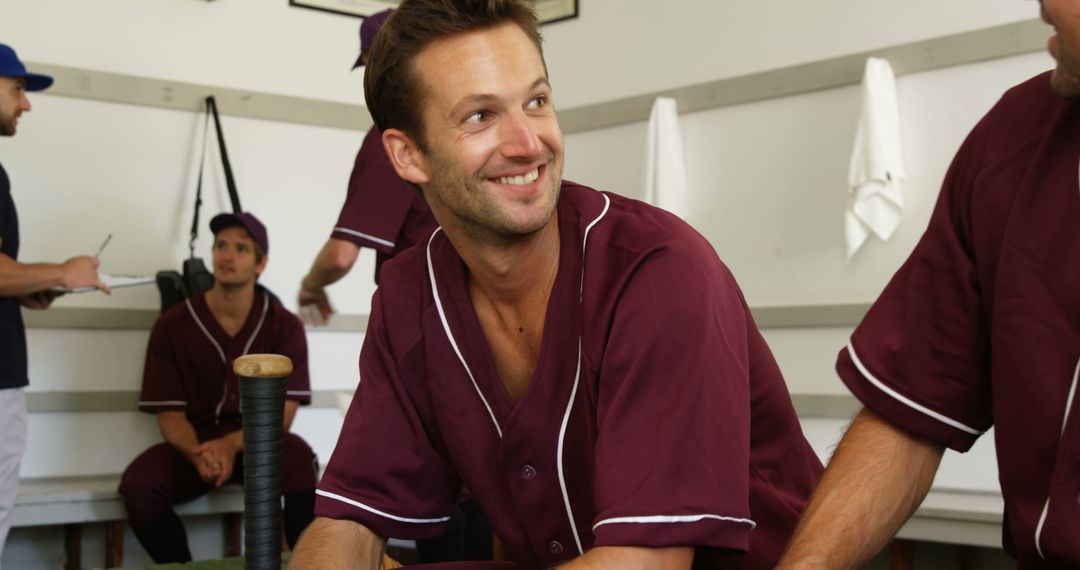 Baseball Team Members Relaxing in Locker Room - Free Images, Stock Photos and Pictures on Pikwizard.com