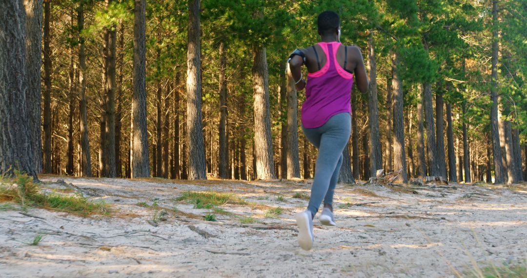 Runner Exercising on Trail in Forest - Free Images, Stock Photos and Pictures on Pikwizard.com