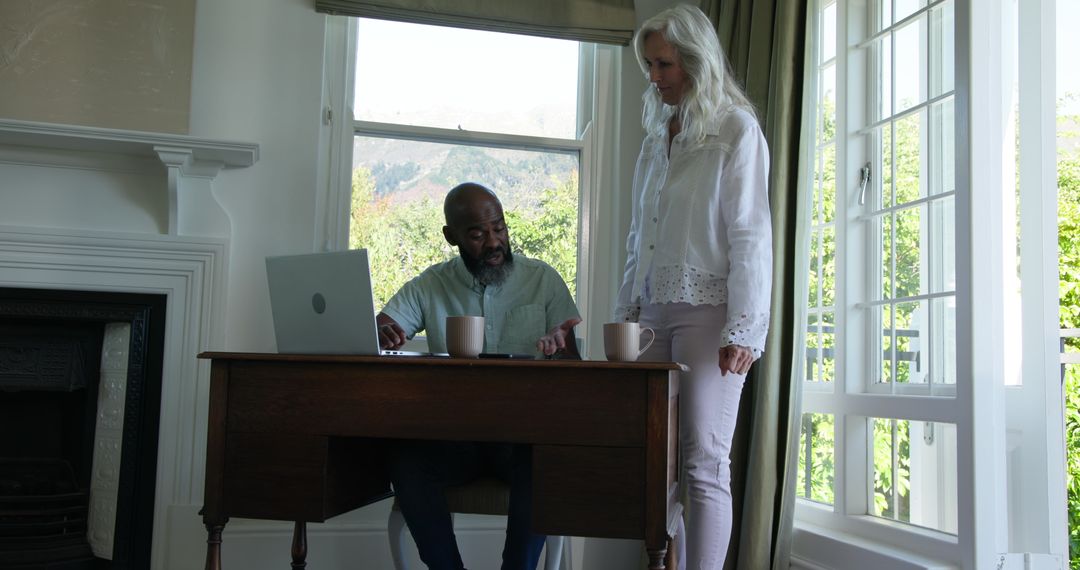 Man Discussing Work with Woman in Bright Home Office
