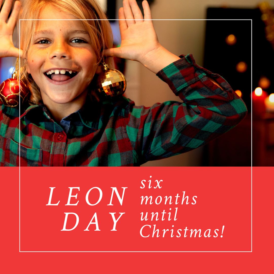 Cheerful Child Celebrating LEON Day with Christmas Ornaments