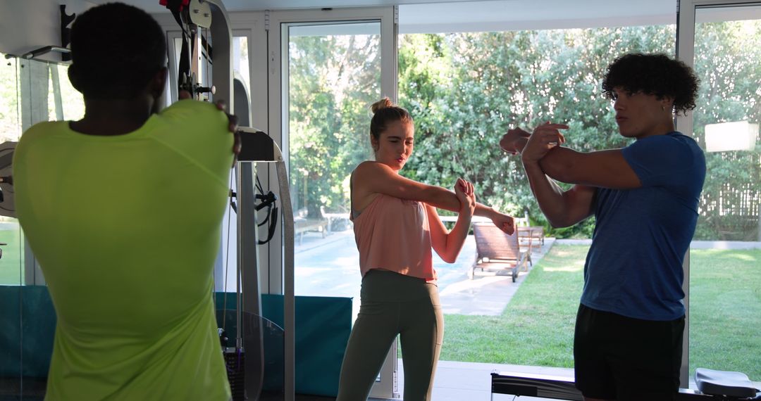 Group Stretching Pre-Workout Routine in Modern Home Gym