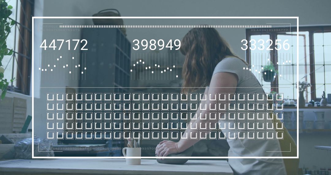 Female Potter at Work with Digital Overlays in Craft Studio