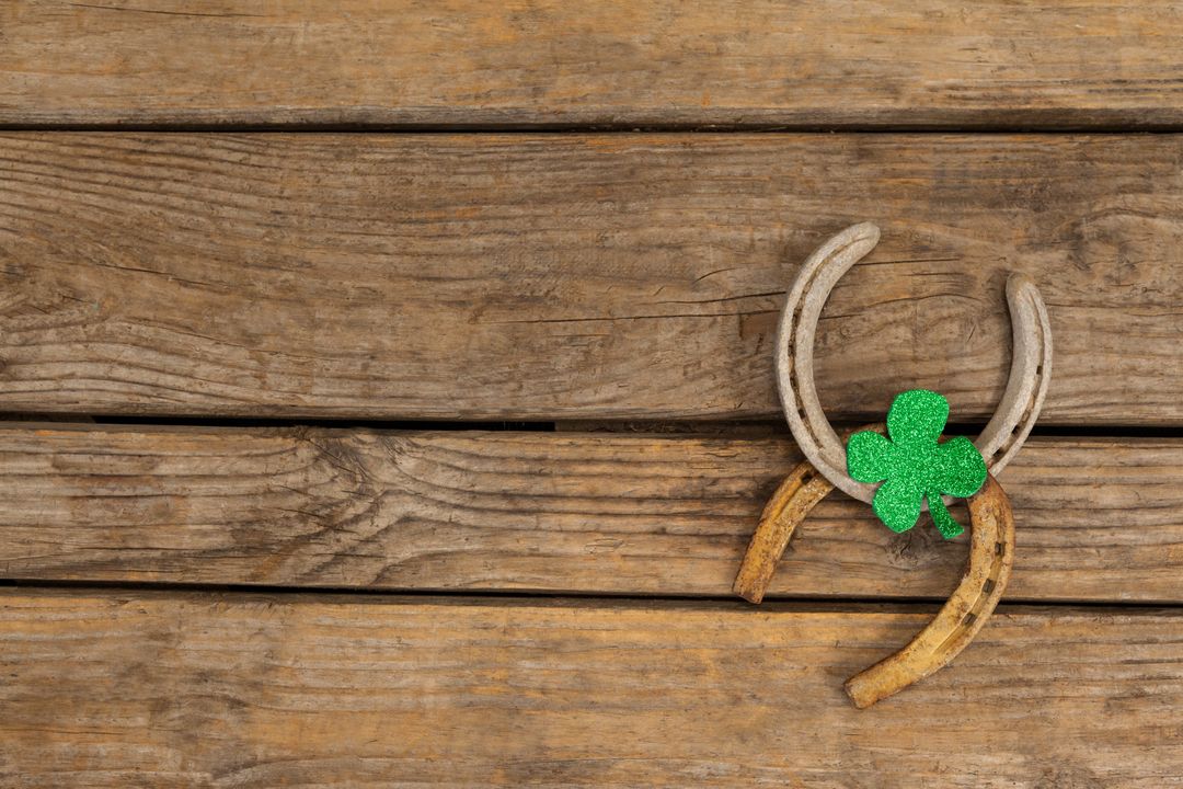 St Patricks Day shamrock with two horseshoes - Free Images, Stock Photos and Pictures on Pikwizard.com