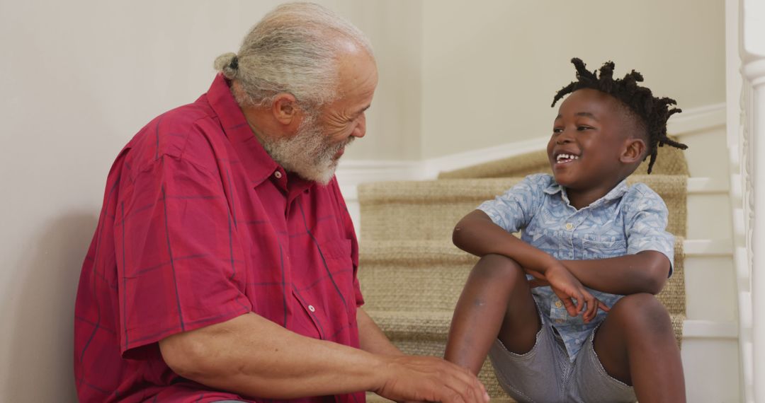 Grandfather and Grandson Sharing a Moment on Stairs - Free Images, Stock Photos and Pictures on Pikwizard.com