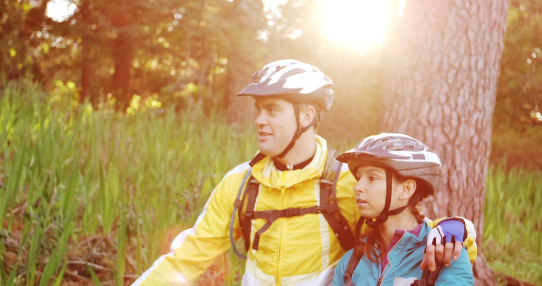 Couple Enjoying Break During Forest Cycling Adventure