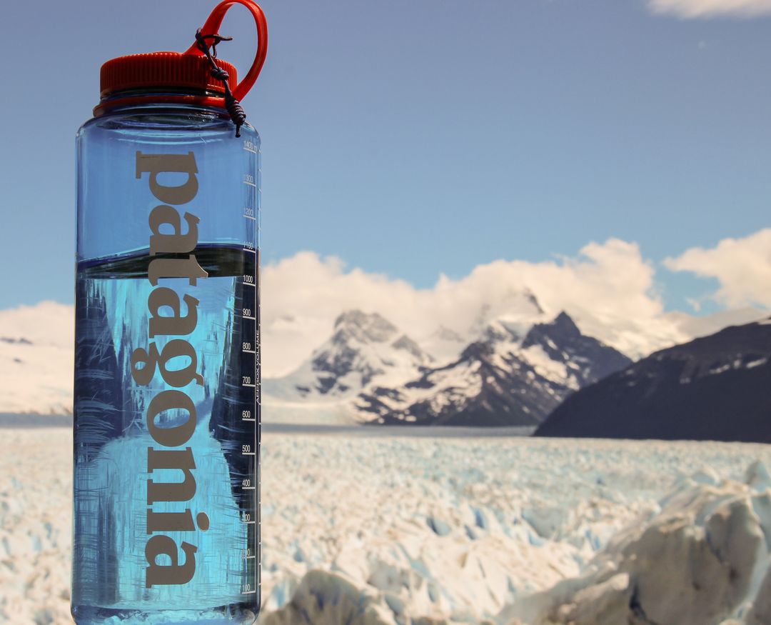 Water bottle with Patagonia logo and glacier mountain background - Free Images, Stock Photos and Pictures on Pikwizard.com