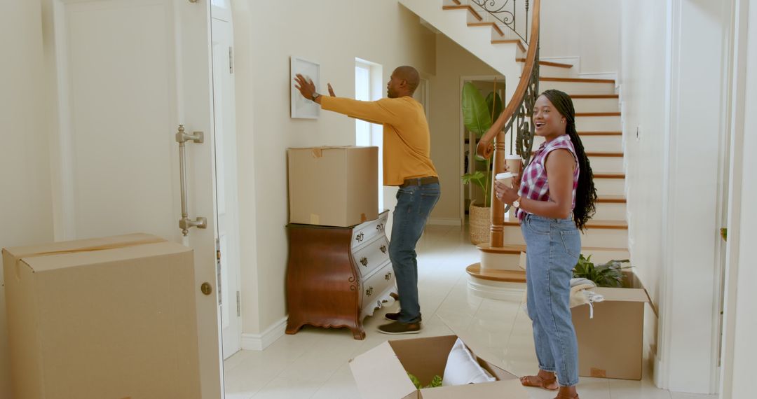 Couple Arranging Their New Home Enthusiastically