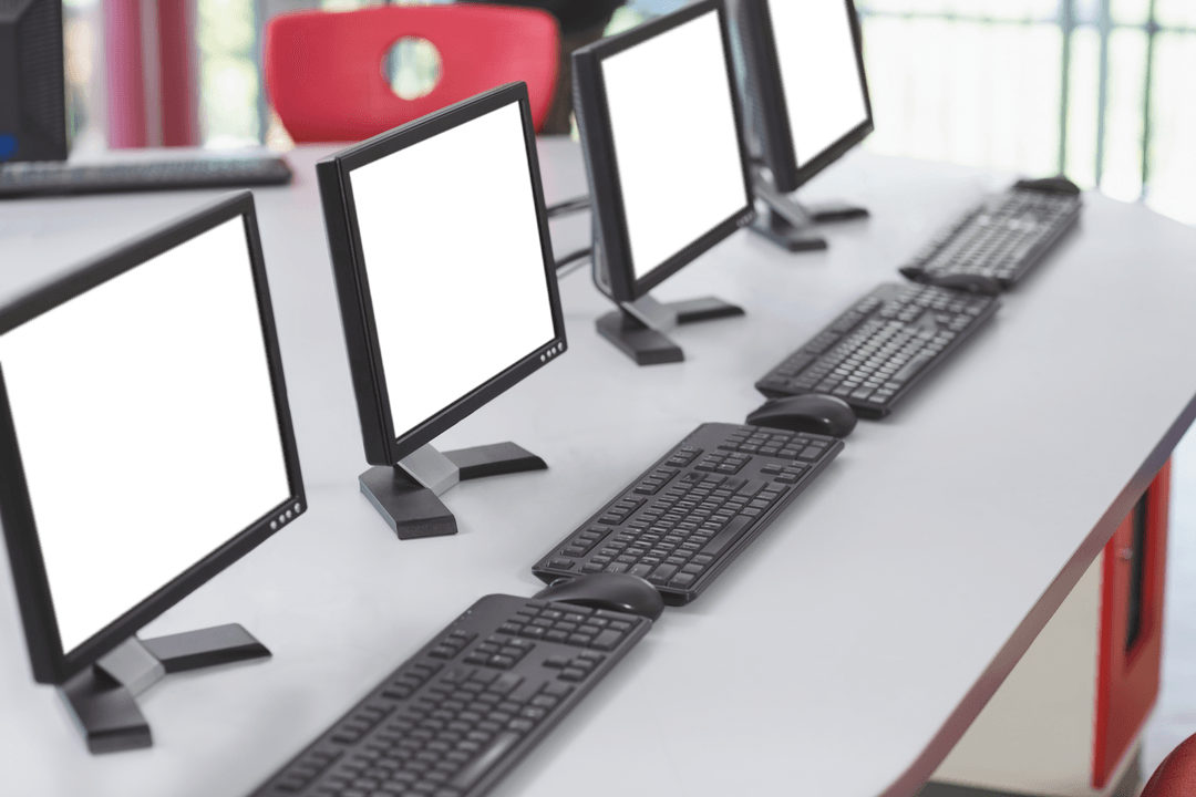 Row of Transparent Monitors and Keyboards in Classroom Setting