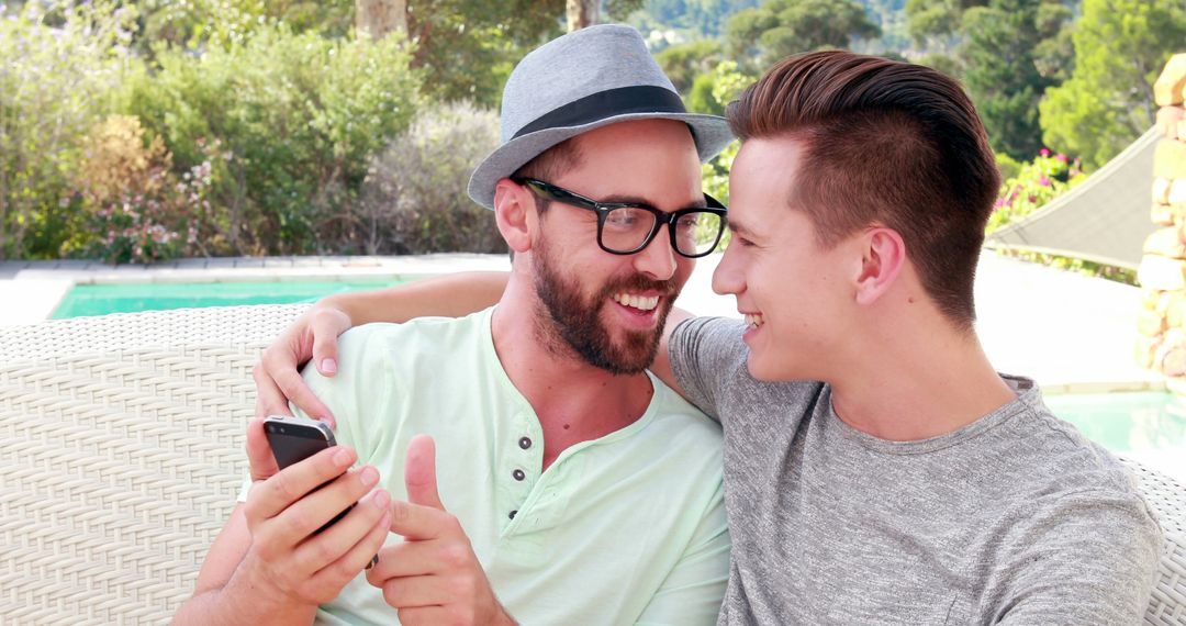 Smiling Friends Sharing a Moment by the Poolside