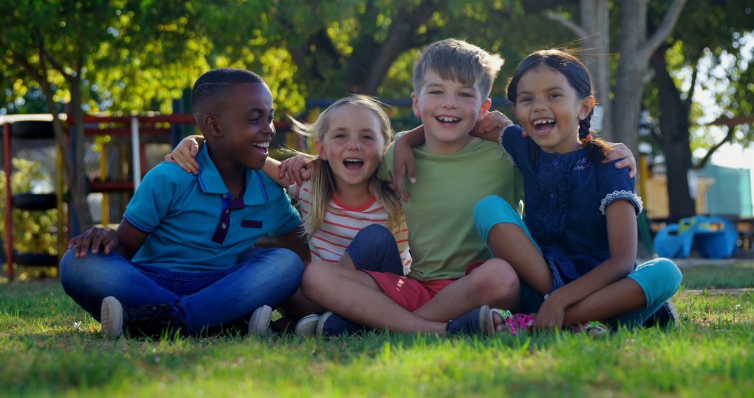 Happy Diverse Group of Children Sitting in Park and Smiling Together - Free Images, Stock Photos and Pictures on Pikwizard.com