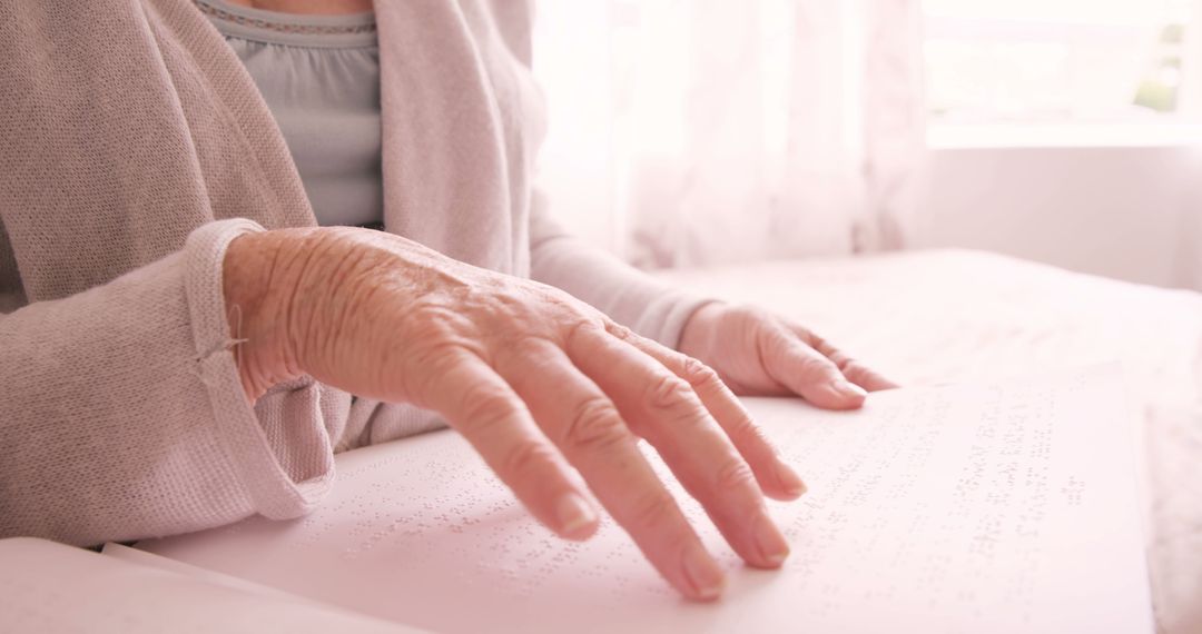 Elderly Person Reading Braille with Tender Fingertips - Free Images, Stock Photos and Pictures on Pikwizard.com