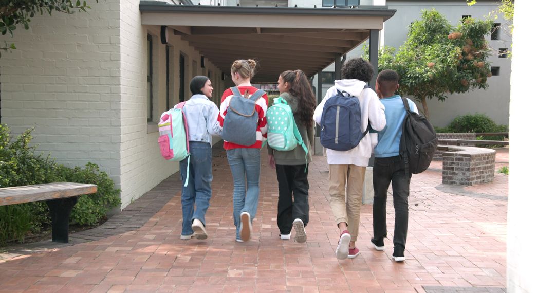 Diverse Schoolchildren Walking Together on Campus