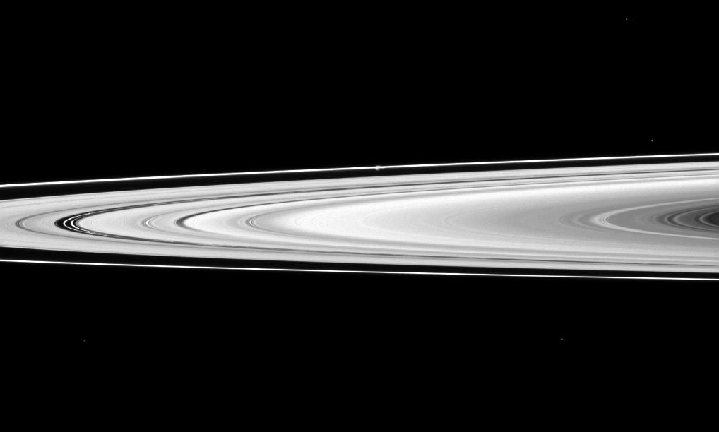 NASA Cassini Spacecraft Captures Saturn’s Rings and Prometheus Moon - Free Images, Stock Photos and Pictures on Pikwizard.com