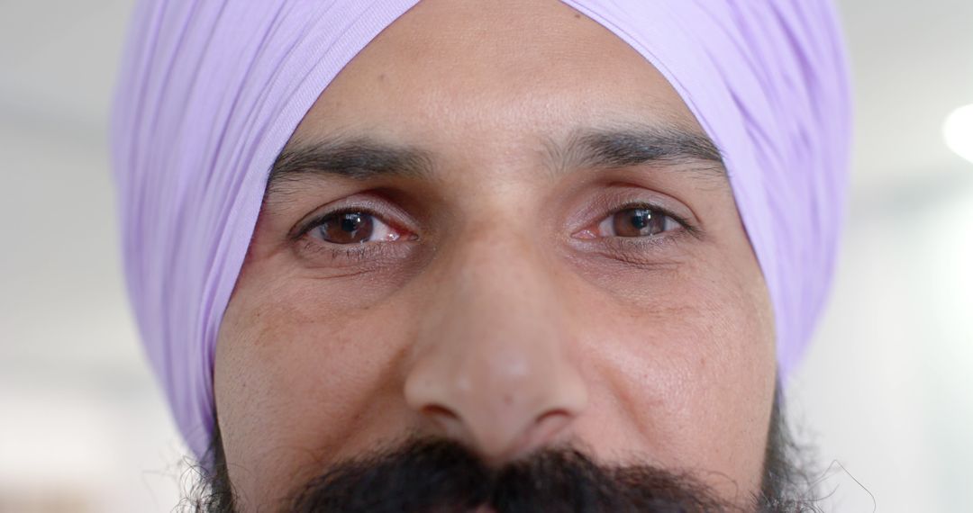 Close-Up Portrait of Man Wearing Lavender Turban and Beard - Free Images, Stock Photos and Pictures on Pikwizard.com