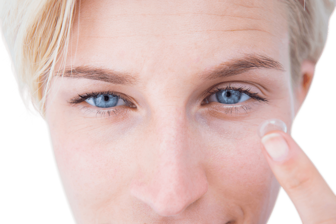 Close-up Blonde Woman Applying Transparent Contact Lens