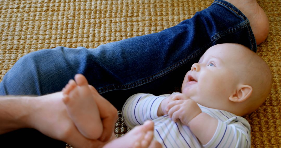 Parent and Baby Bonding on Carpeted Floor - Free Images, Stock Photos and Pictures on Pikwizard.com