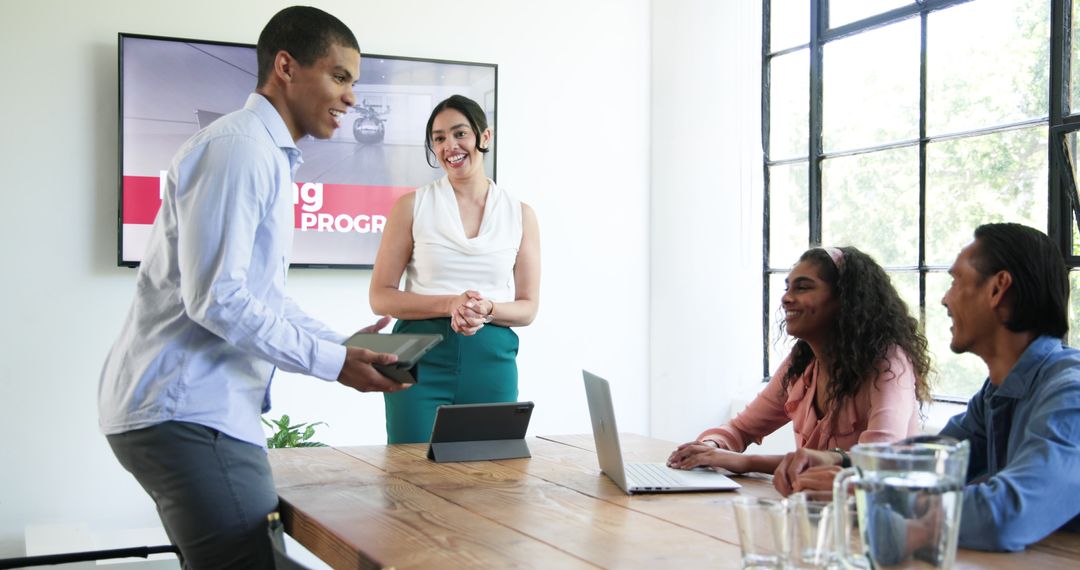 Smiling Multiracial Team Collaborating in Bright Modern Office