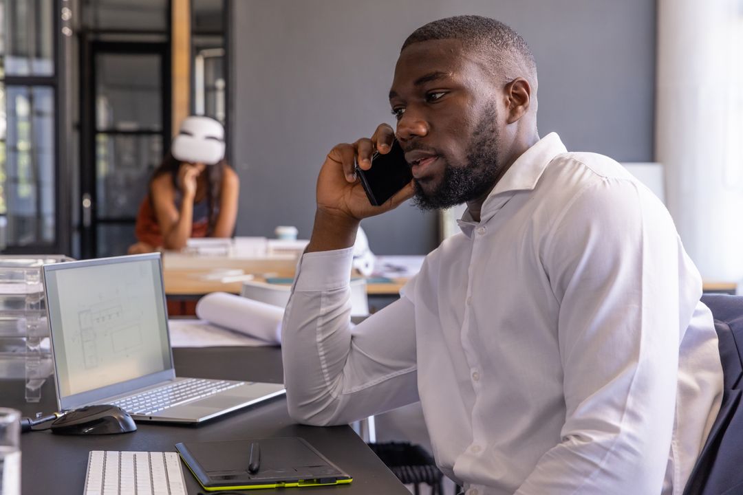 Architectural Team Collaborating with Digital Tools in Modern Studio