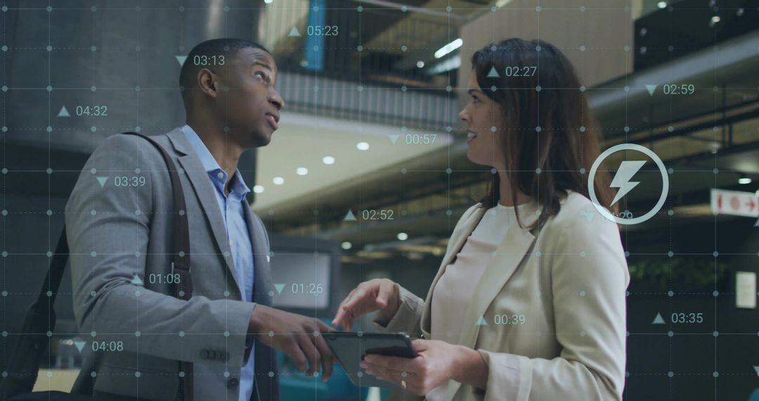 Colleagues Analyzing Data Solutions in Modern Corporate Environment