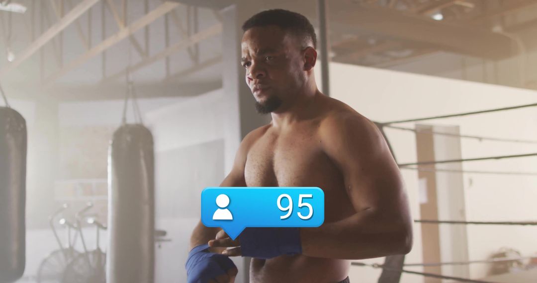 Boxer Wrapping Hands with Social Media Icon in Gym Ambiance
