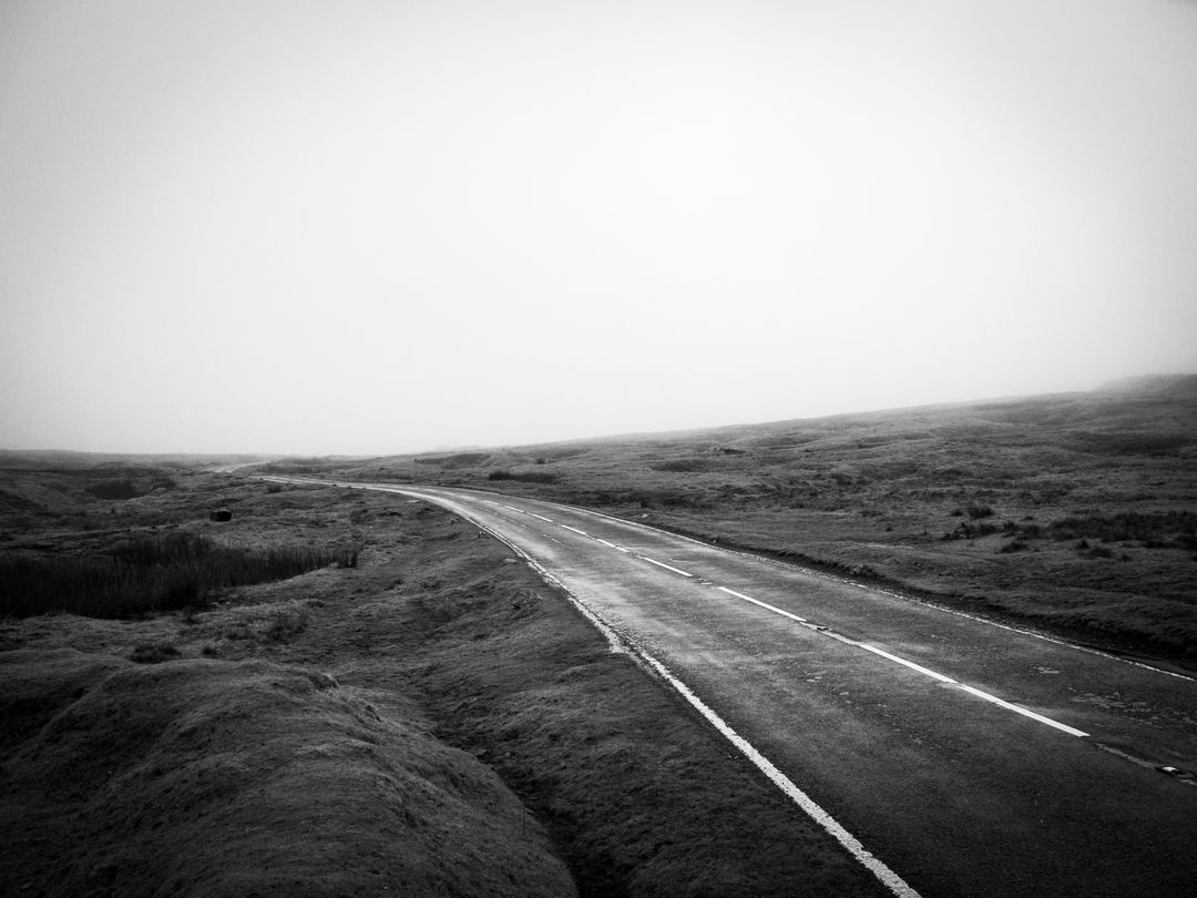 Desolate Road Winding Through Foggy Countryside - Free Images, Stock Photos and Pictures on Pikwizard.com