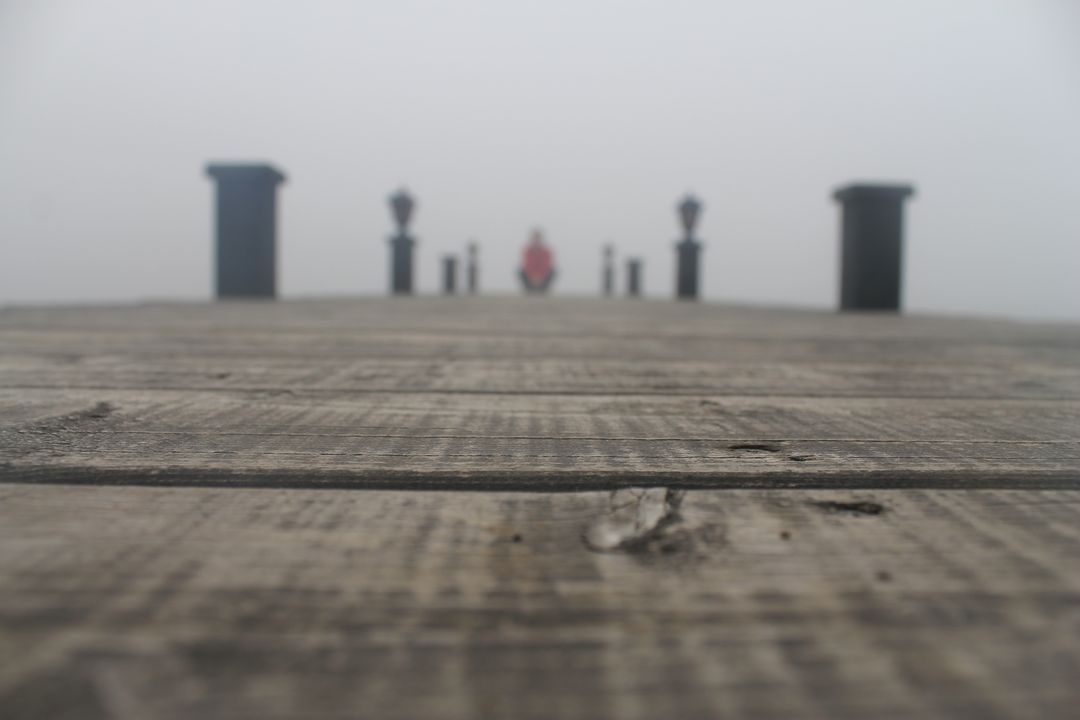 Blurred Silhouette on Wooden Pier in Misty Weather - Free Images, Stock Photos and Pictures on Pikwizard.com