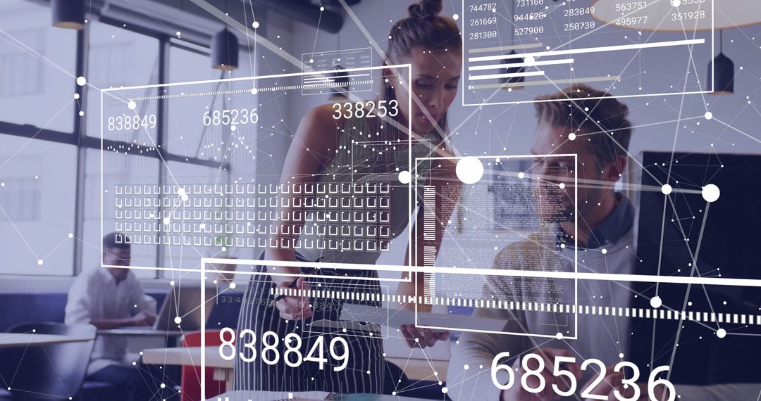 Coworkers Analyzing Digital Data in Modern Office Workspace