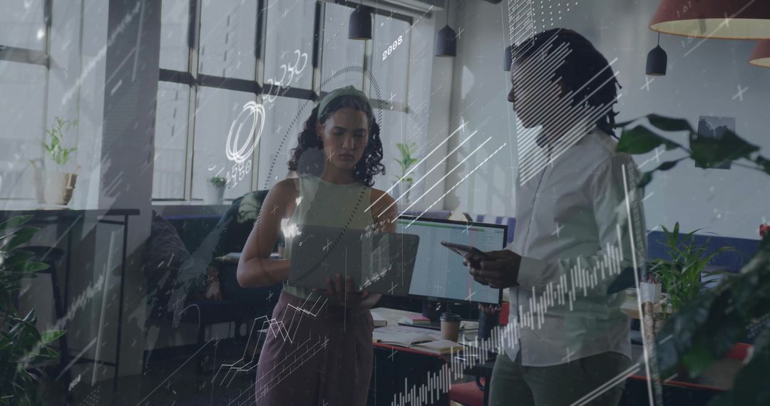 Coworkers Analyzing Digital Data Trends in Modern Workspace