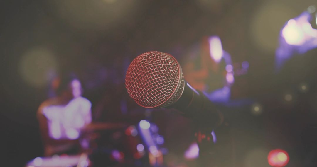 Microphone in Spotlights with Band in Club Ambience