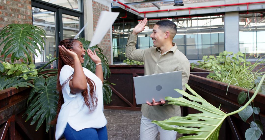 Celebratory Office High-Five Achieving Team Success