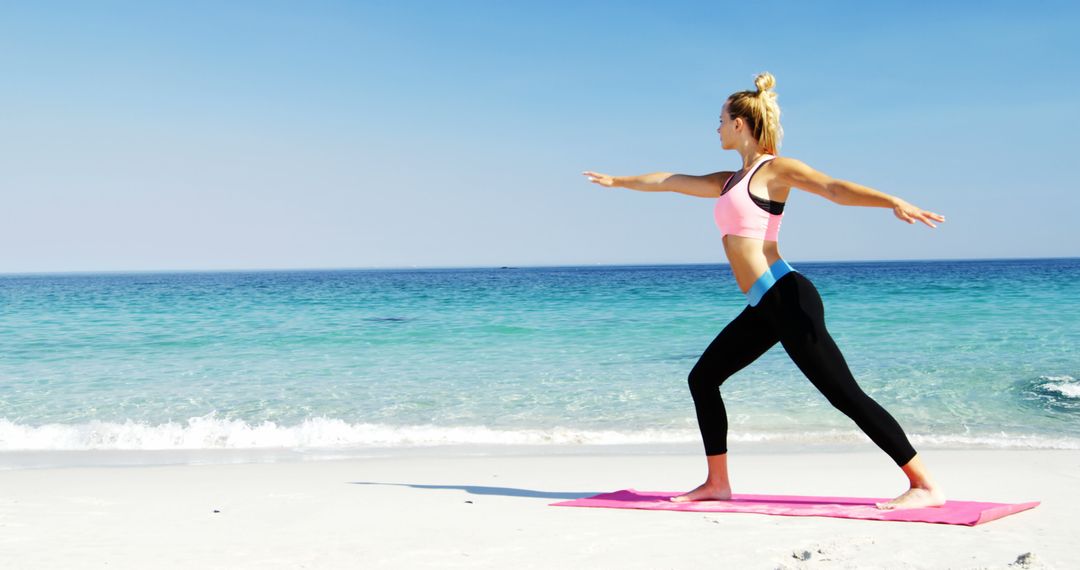 Woman Practicing Yoga Warrior Pose on Beach at Sunset - Free Images, Stock Photos and Pictures on Pikwizard.com