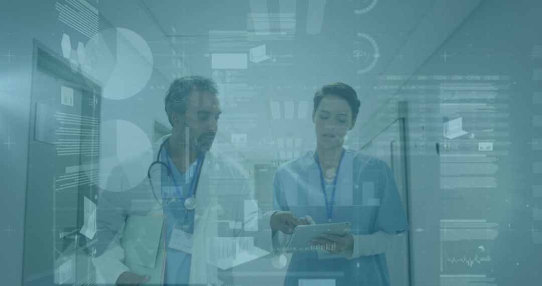 Medical Professionals Analyzing Data on Tablet in Hospital Corridor - Free Images, Stock Photos and Pictures on Pikwizard.com