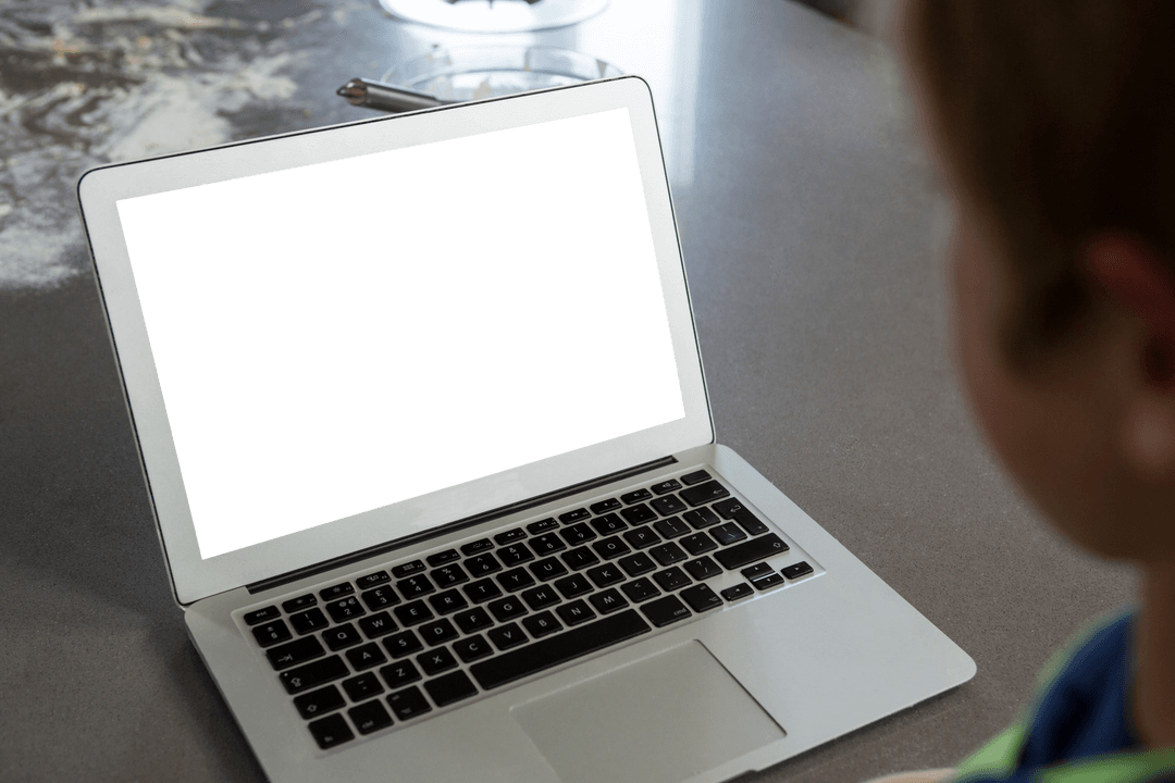 Child Watching Transparent Screen Laptop on Kitchen Counter
