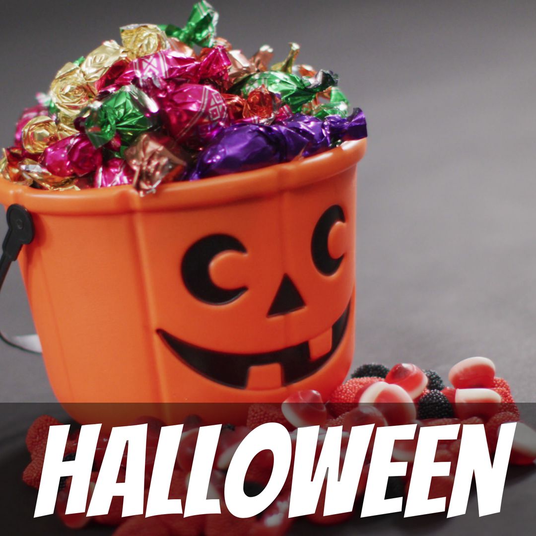 Halloween Pumpkin Bucket Overflowing with Colorful Sweets