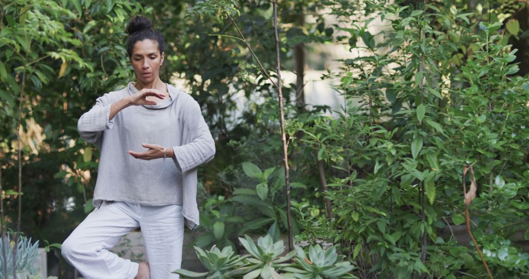 Woman Practicing Yoga in Lush Garden Setting - Free Images, Stock Photos and Pictures on Pikwizard.com