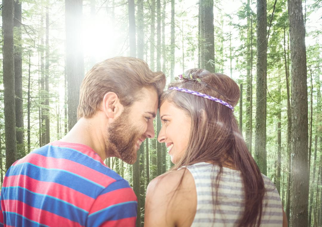 Smiling Couple in Forest with Sunlight Filtering through Trees - Free Images, Stock Photos and Pictures on Pikwizard.com