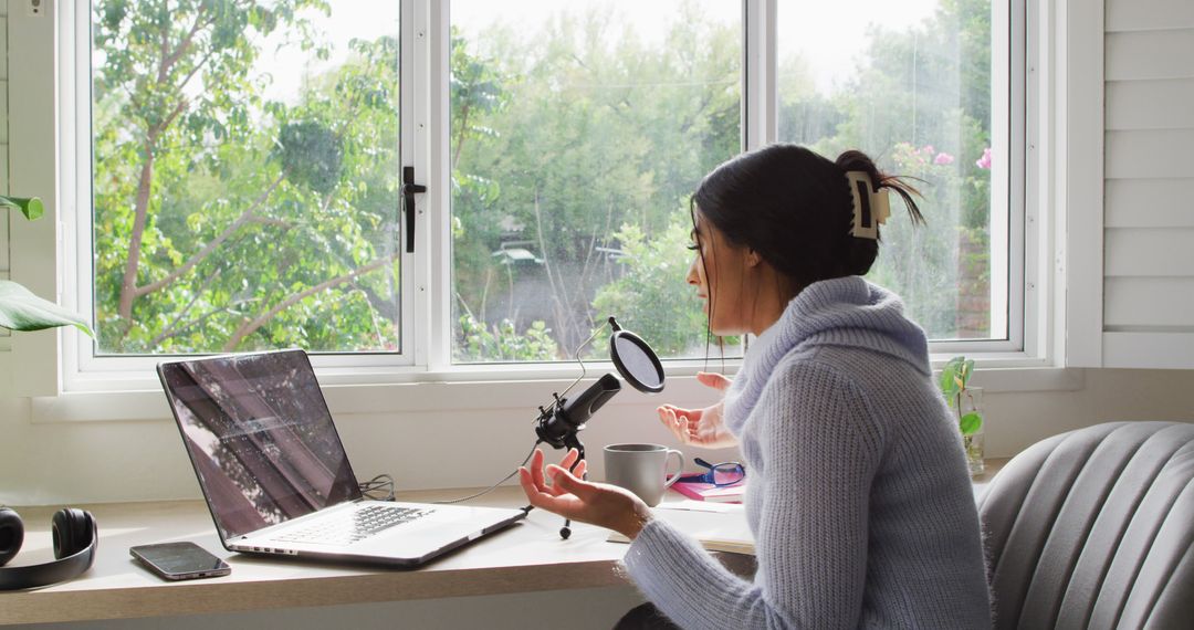 Image of biracial woman taking part in online interview on laptop at home - Free Images, Stock Photos and Pictures on Pikwizard.com