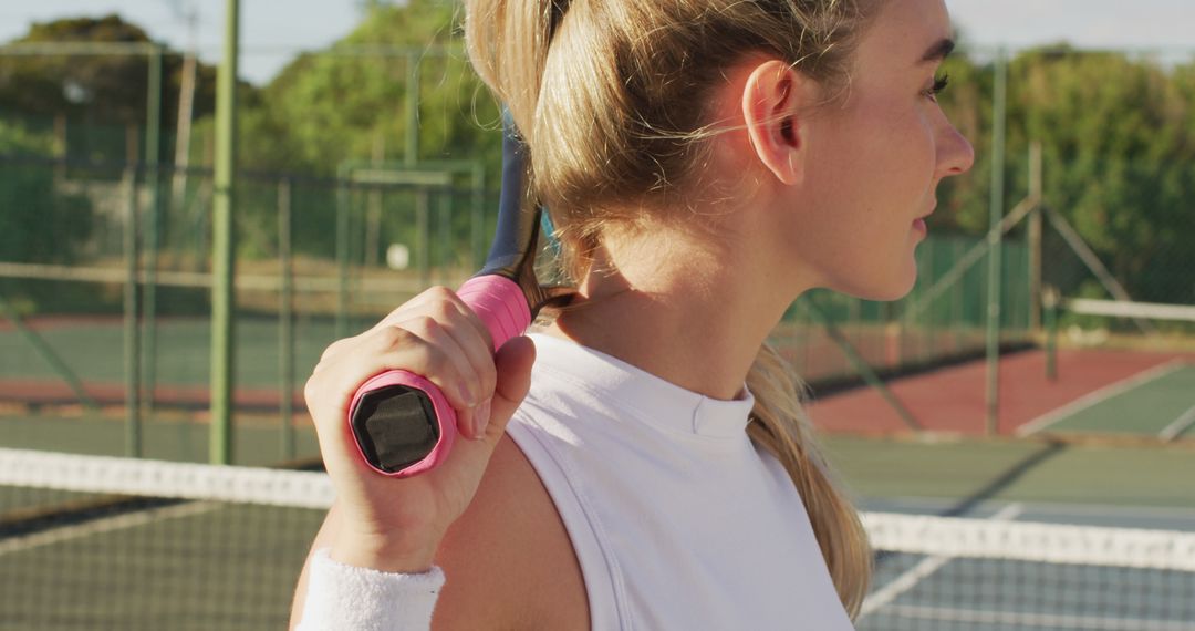 Image of caucasian female tennis player holding racket and looking at camera - Free Images, Stock Photos and Pictures on Pikwizard.com