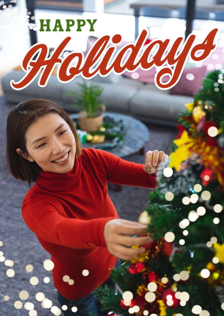 Smiling Woman Decorating Christmas Tree With Happy Holidays Text - Download Free Stock Templates Pikwizard.com