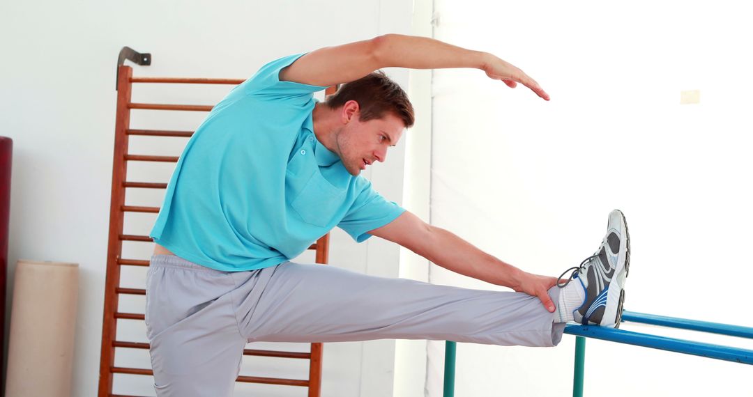 Young Man Stretching During Physio Session - Free Images, Stock Photos and Pictures on Pikwizard.com