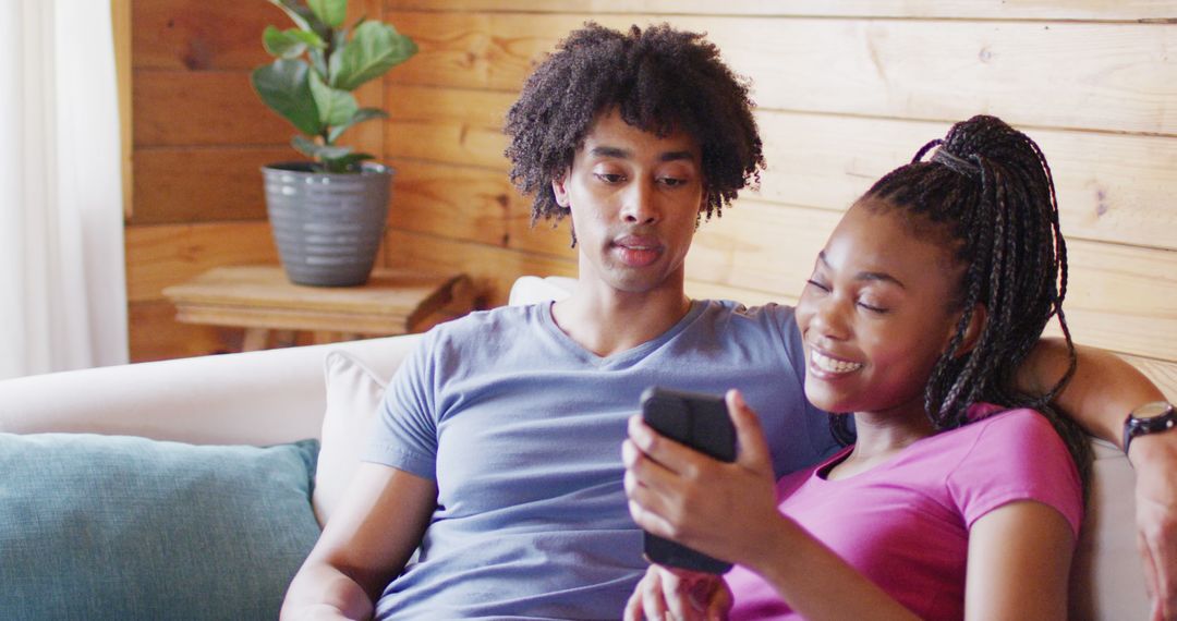 Couple Enjoying Leisure Time Together on Sofa