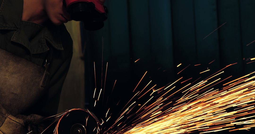 Metalworker in Protective Gear Grinding Metal with Sparks - Free Images, Stock Photos and Pictures on Pikwizard.com