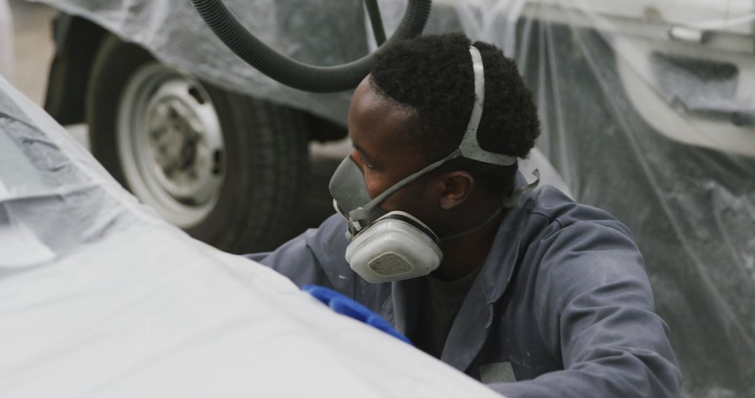 Auto Mechanic Spray Painting Car in Workshop - Free Images, Stock Photos and Pictures on Pikwizard.com