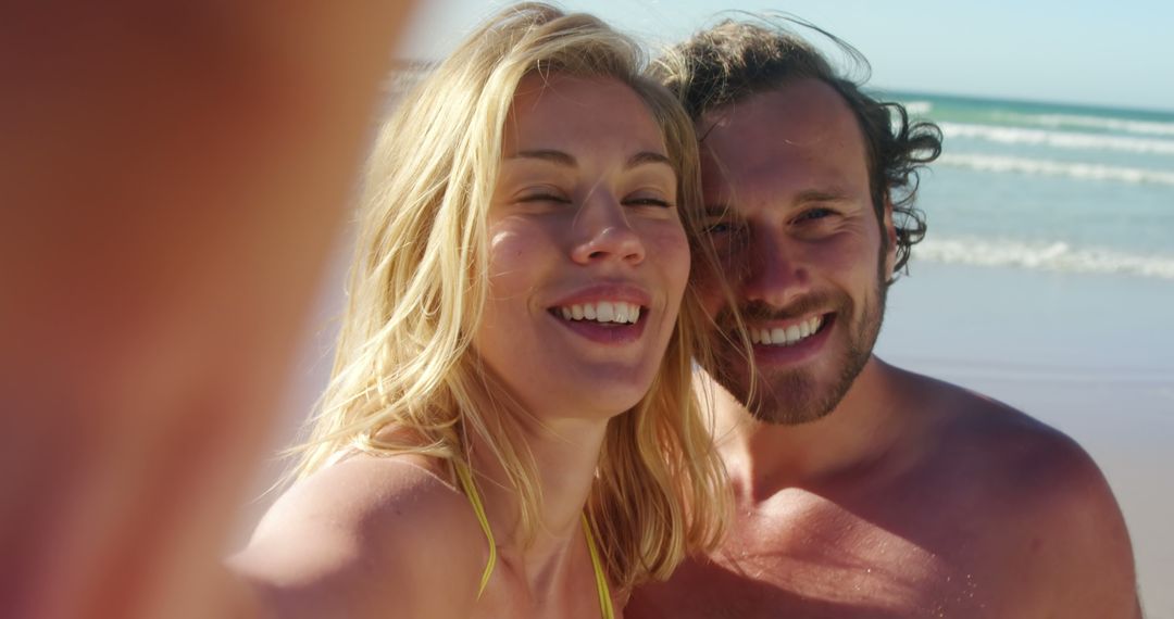 Happy Couple Taking Selfie on Beach on Sunny Day - Free Images, Stock Photos and Pictures on Pikwizard.com