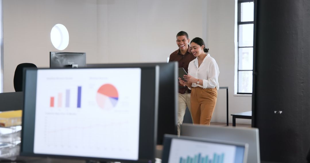 Multicultural Colleagues Discussing in Modern Office