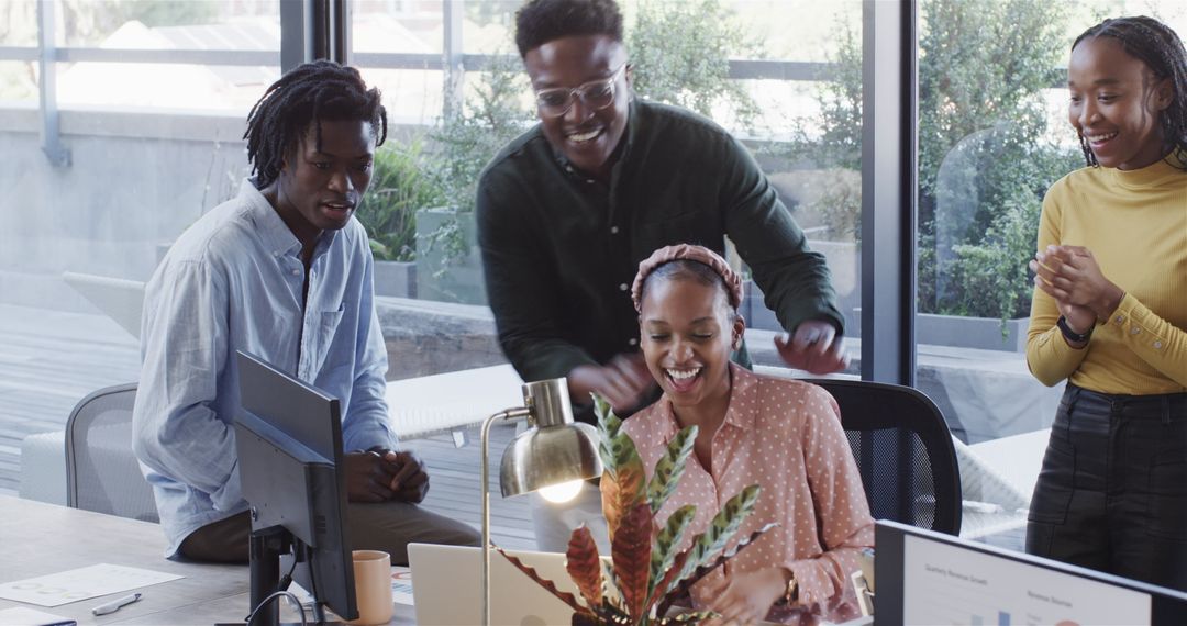 Smiling Team of Diverse Colleagues Collaborating in Modern Office