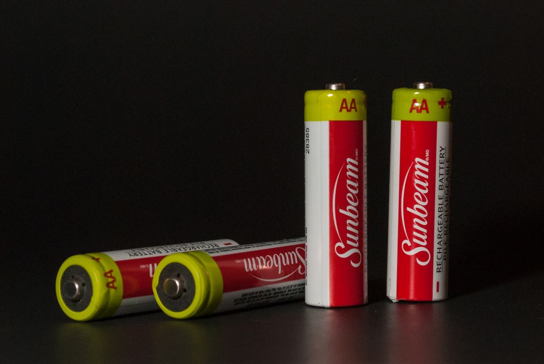 Four AA Batteries on Dark Background - Free Images, Stock Photos and Pictures on Pikwizard.com