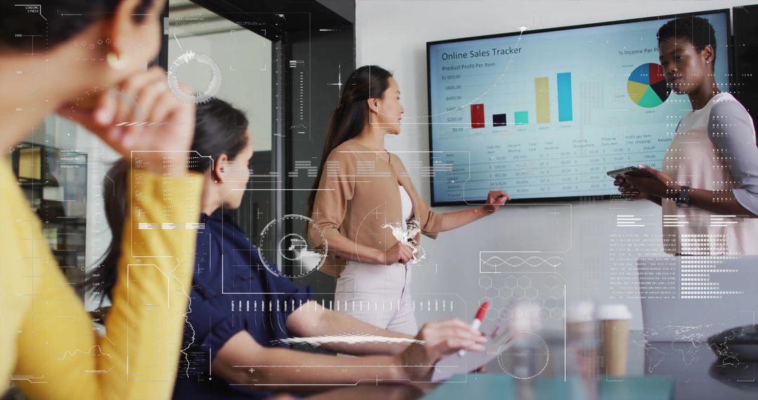 Diverse Team Analyzing Digital Sales Data during Business Meeting