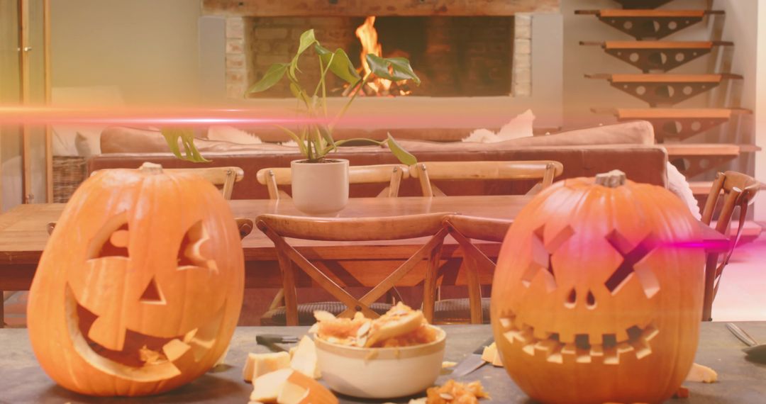 Carving Pumpkins on Rustic Dining Table with Fireplace Glow and Autumn Ambience